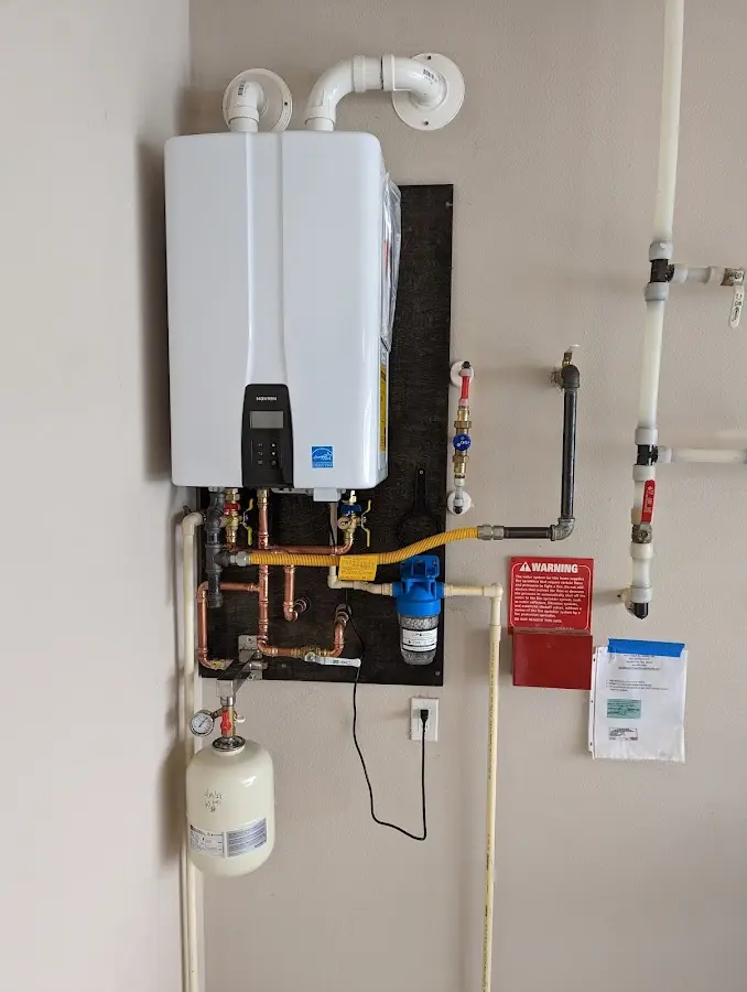 Professional plumber installing copper piping in a Lauderhill home